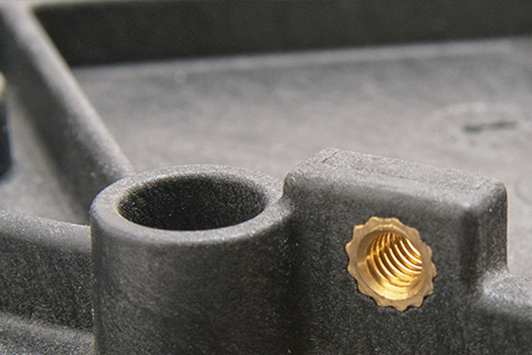 Part produced by insert molding