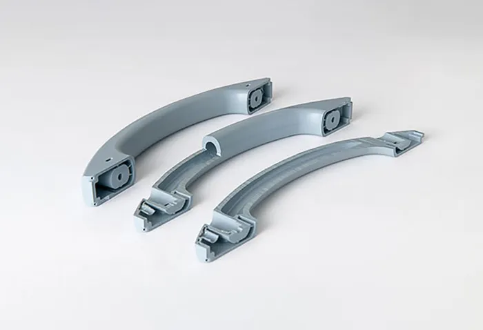 Handle produced by gas-assisted injection molding